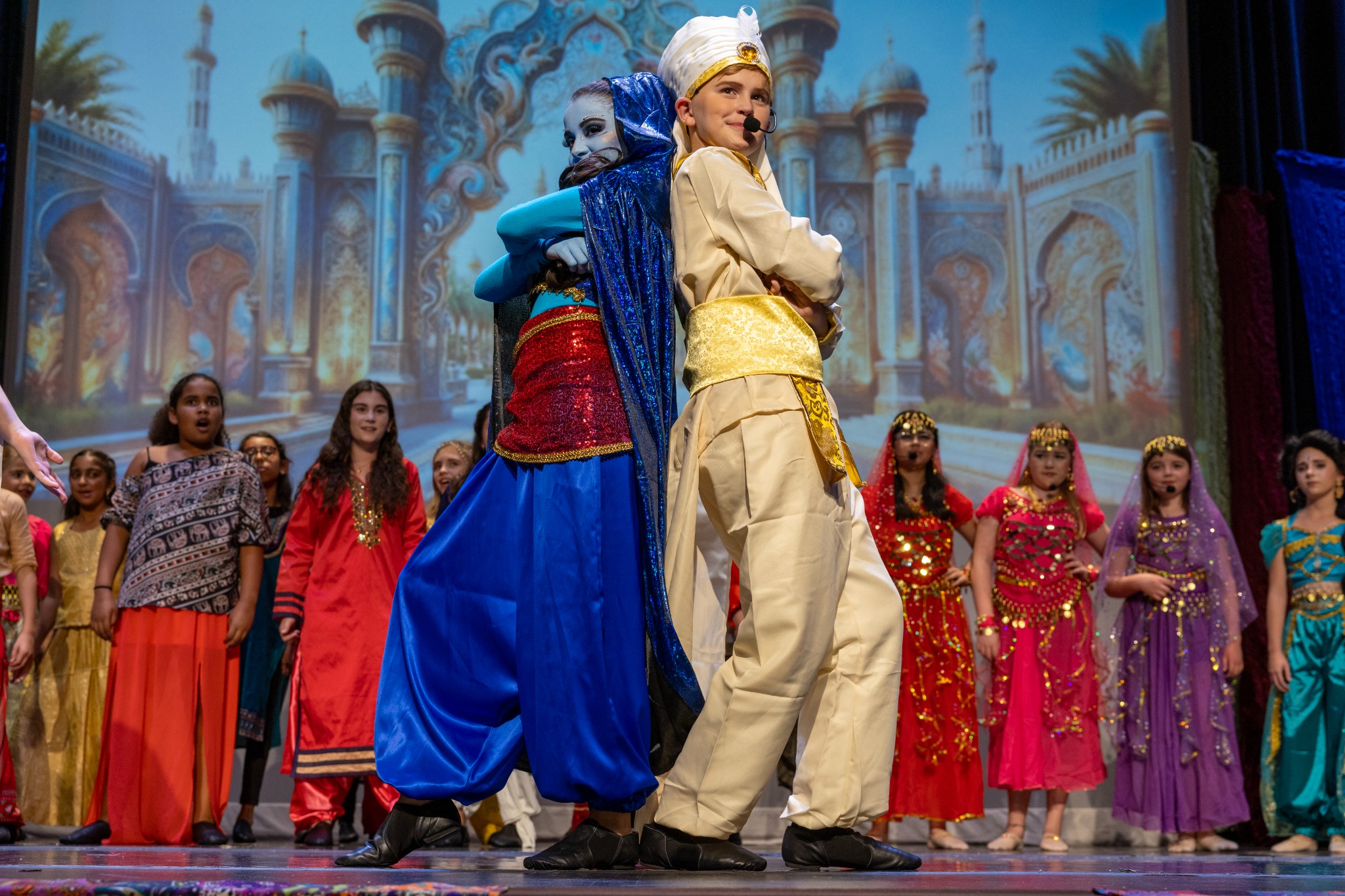 Young performers on stage in Melendez Theatre's production of Aladdin Jr.