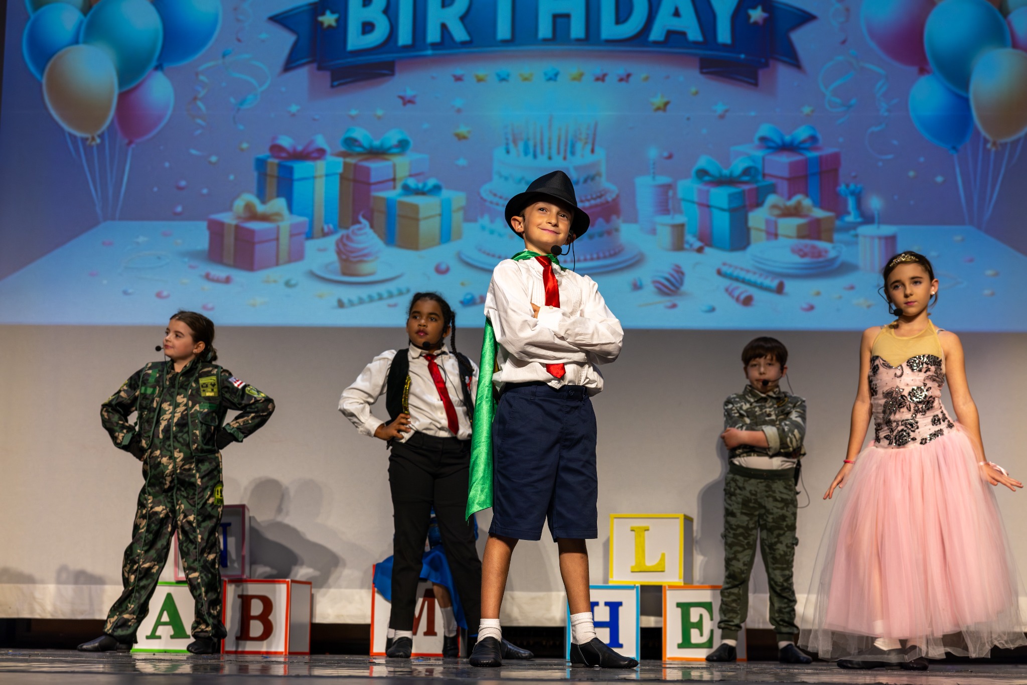 Young performers onstage in MTE's 2024 production of Matilda